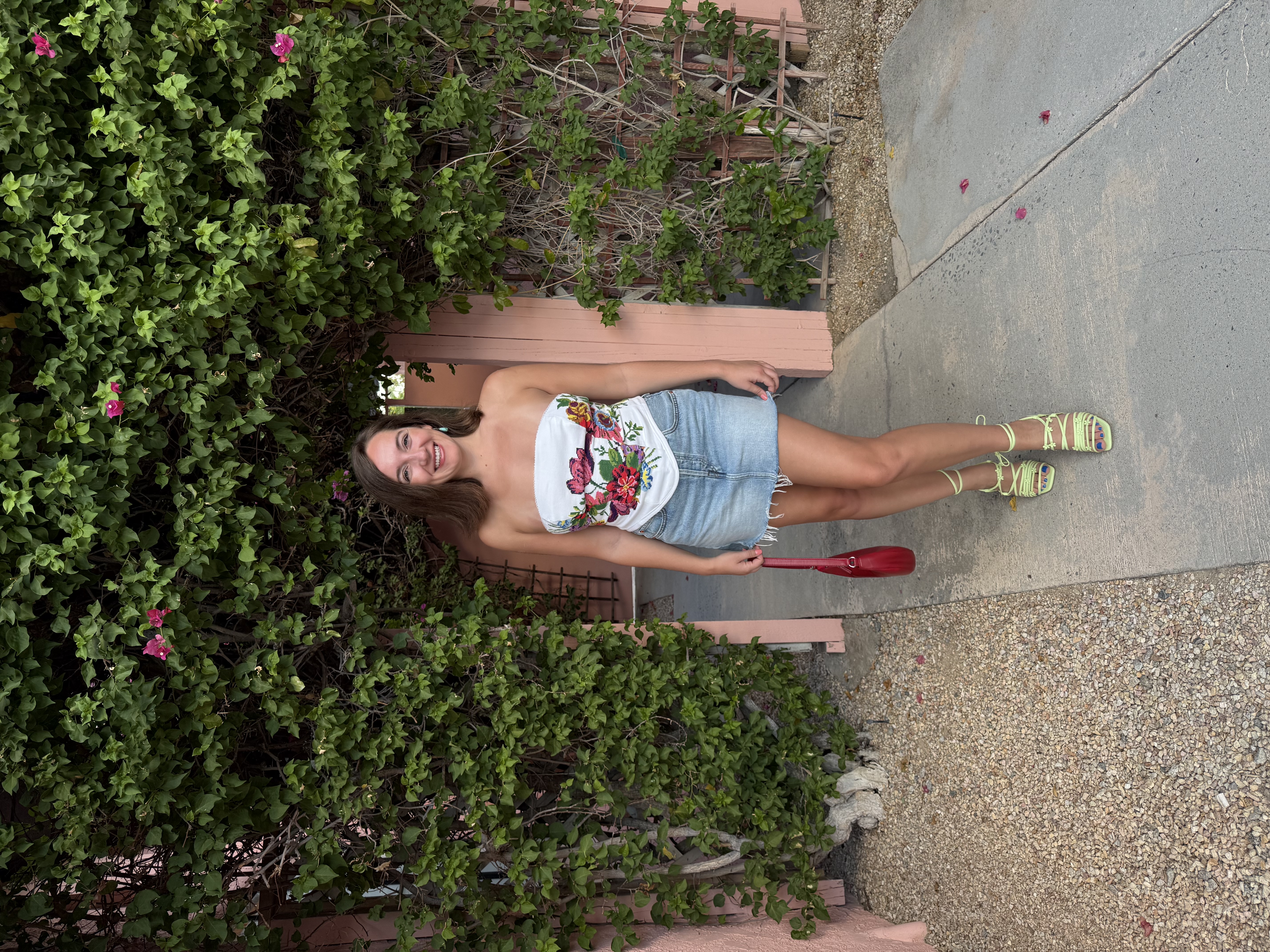 Emily wearing the finished corset top made from needlepoint pillowcases